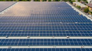 bird’s‑eye view of a large rooftop solar‑panel installation in athens region, taken by a drone, showcasing grid layout, clean lines, modern infrastructure, high resolution.